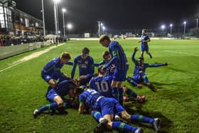 The record-breaking Latics Under-18 side celebrate another goal