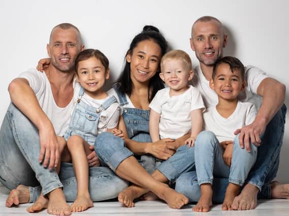 Andrew and Kevin Atherton with, from left, Andrews daughter Kamali, his wife Gasya, Kevins son Luca and Andrews son Kaysen