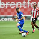Wigan captain Sam Morsy in the thick of the action
