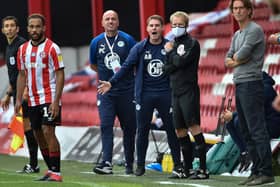 Brentford manager Thomas Frank, right, and Wigan counterpart Paul Cook