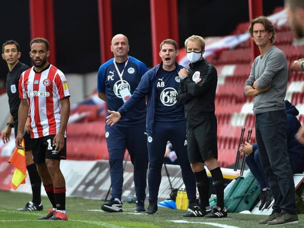 Brentford manager Thomas Frank, right, and Wigan counterpart Paul Cook