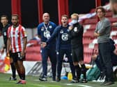Brentford manager Thomas Frank, right, and Wigan counterpart Paul Cook
