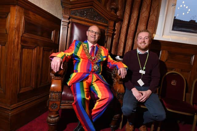 The mayor in his Pride suit with Alex Miller from the borough's archives
