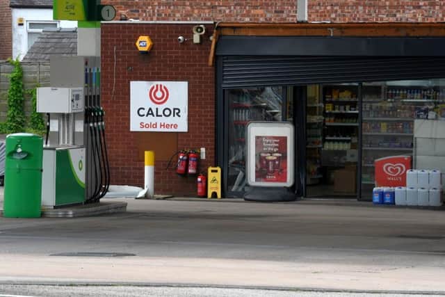Shutters appeared to be damaged at the petrol station