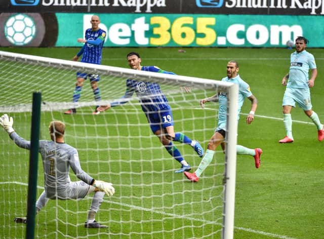 Kieffer Moore blasts home to give Wigan the lead