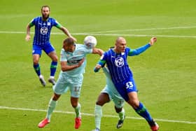 Wigan's Kai Naismithputs his head where it hurts