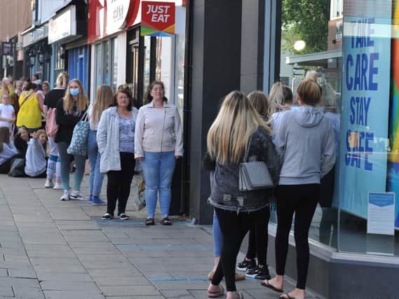 Healthy queues outside Wigan shops