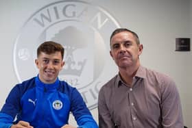 Jensen Weir signs his first pro deal with Latics, watched by father David