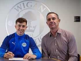 Jensen Weir signs his first pro deal with Latics, watched by father David