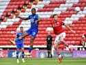 Jamal Lowe rises high to meet the ball ahead of Michael Sollbauer