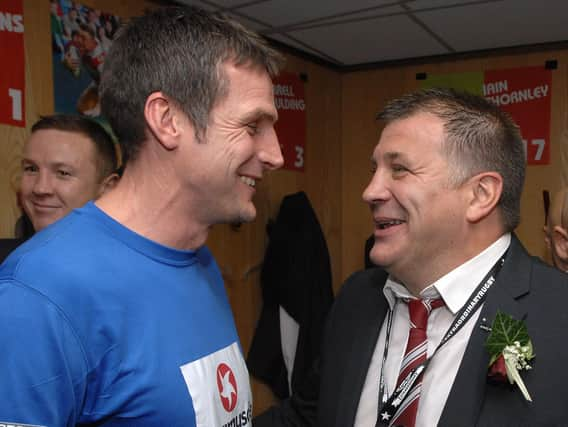 Mick Turner celebrating Grand Final success with coach Shaun Wane in 2013