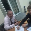 Joe Howarth signs on the dotted line