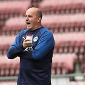 Paul Cook with trademark brew