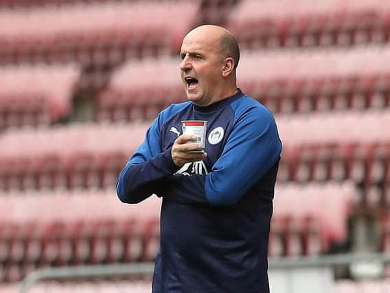 Paul Cook with trademark brew