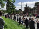 Residents protest against the plans outside St Peter's Church in Bryn