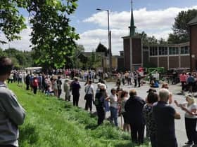 Residents protest against the plans outside St Peter's Church in Bryn