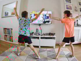 Ben and Isaac Rickett take part in the last session of PE with Joe, the online fitness workout by fitness coach Joe Wicks, at their home