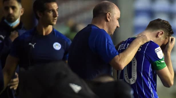 Paul Cook consoles Joe Williams after the final whistle
