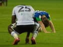 Joe Gelhardt sinks to the turf on Wednesday night