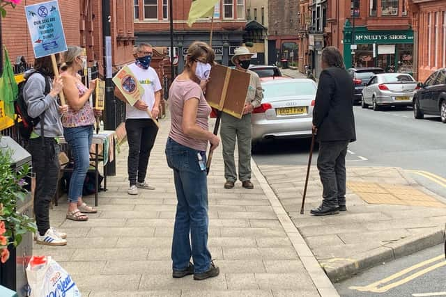 XR Wigan activists hold a vigil outside the town hall