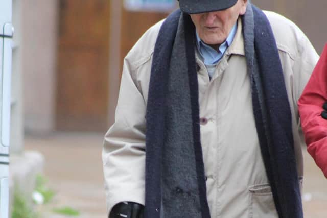Father John Kevin Murphy outside court
