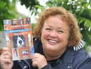 Michelle Glaister with her book of pandemic poems
