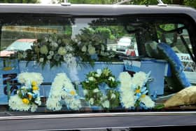 A blue coffin marked Jack's love of Manchester City