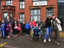 Families outside Hop, Skip and Jump, including Emma Eastham and son Alex, 14, right