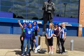 The fund-raising ladies take a break to pose with Dave Whelan