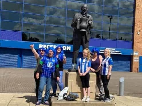 The fund-raising ladies take a break to pose with Dave Whelan