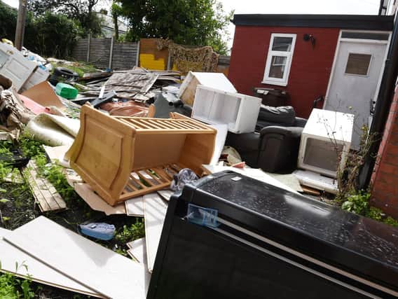The garden of the Primrose Grove property piled up with rubbish