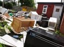 The garden of the Primrose Grove property piled up with rubbish
