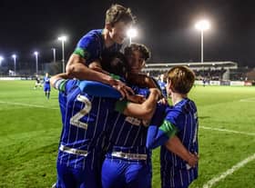 The Latics Under-18 side celebrate thrashing Birmingham  in the FA Youth Cup