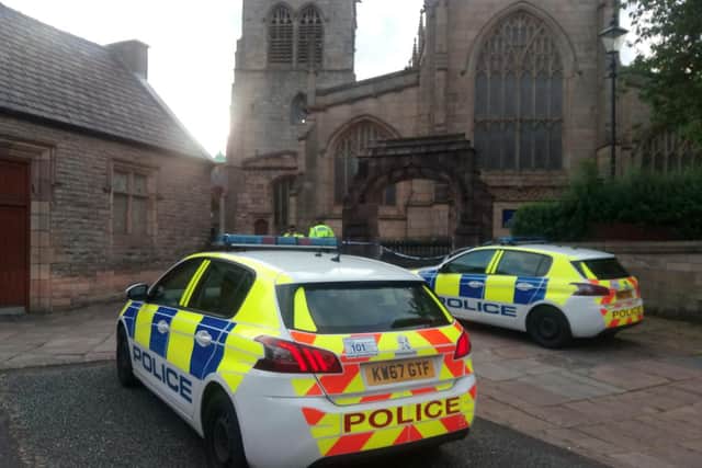 Police remained outside the church on Friday