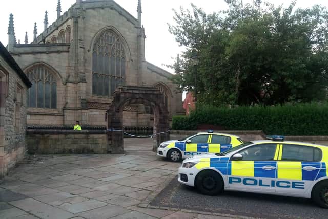 Wigan Parish Church's main entrance on Crawford Street is cordoned off by police
