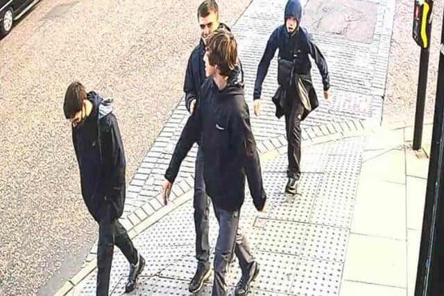 Police would like to speak to these young men caught here on CCTV in Wallgate, Wigan