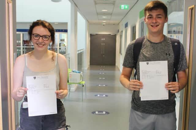Cathryn Gale and Owen Charnock with their A-level results at the Deanery Sixth form