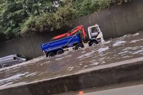 Screen grab from footage taken with permission from the Facebook page of Matt Hickmott of flash flooding on the M25, where it was also raining and hailing