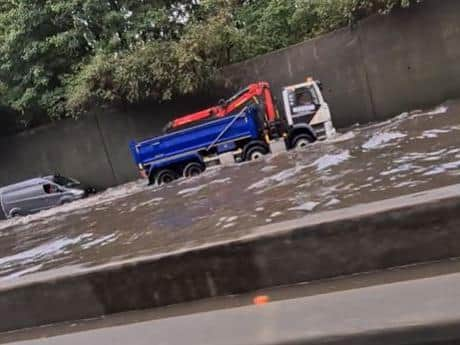 Screen grab from footage taken with permission from the Facebook page of Matt Hickmott of flash flooding on the M25, where it was also raining and hailing