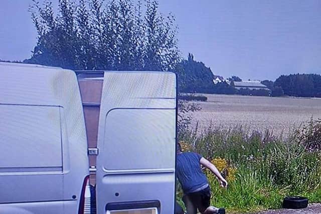 The man can be seen dumping tyres out of a van at Haydock Park Farm