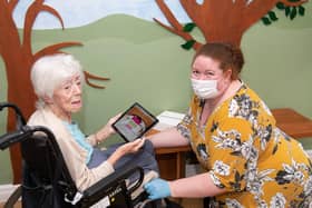 Mahogany Care Home staff making use of one of the donated iPads