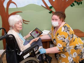 Mahogany Care Home staff making use of one of the donated iPads
