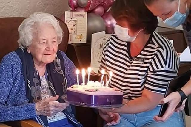 Bertha celebrating her 100th birthday while on Zoom with her family