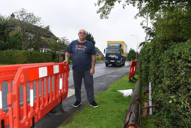 Photo Neil Cross; Residents like Dave Bliss, pictured, are concerned by the amount of road traffic accidents in Miles Lane in Shevington