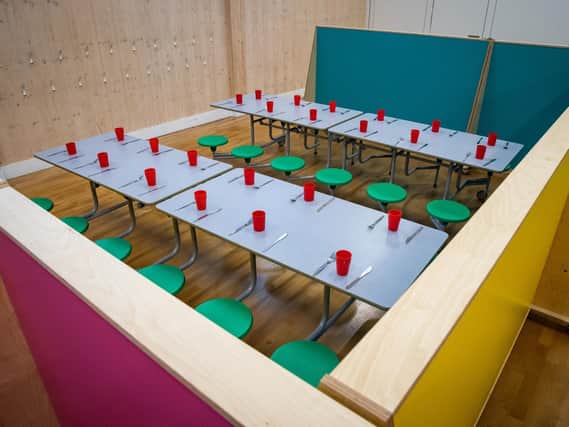 Lunch spaces for different classes separated and spaced at a primary school