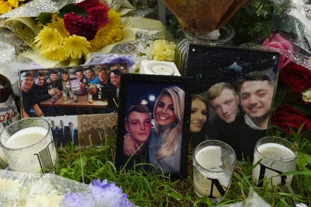 Photographs and candles are among the objects left in memory of Matthew Dutton