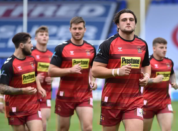 Wigan players warming up last Saturday