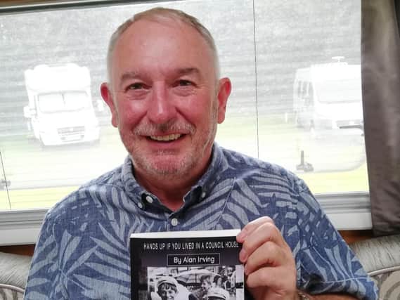 Retired engineer Alan Irving with his book