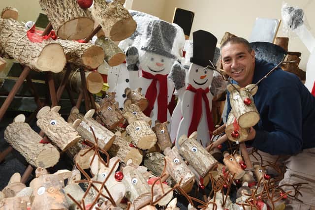 Justin Hinden with some of the homemade Christmas items for sale