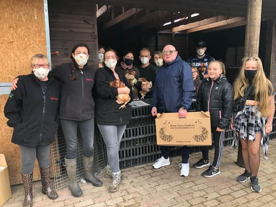 Shaun Ryder with the team at Lucky Hens